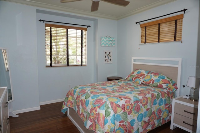 bedroom featuring ceiling fan, dark hardwood / wood-style floors, and crown molding