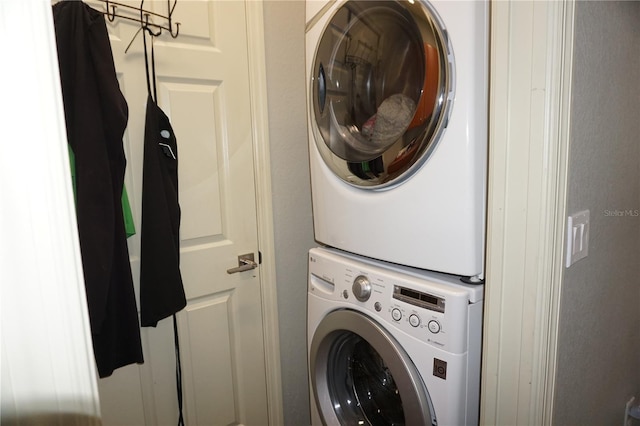 washroom with stacked washer / dryer