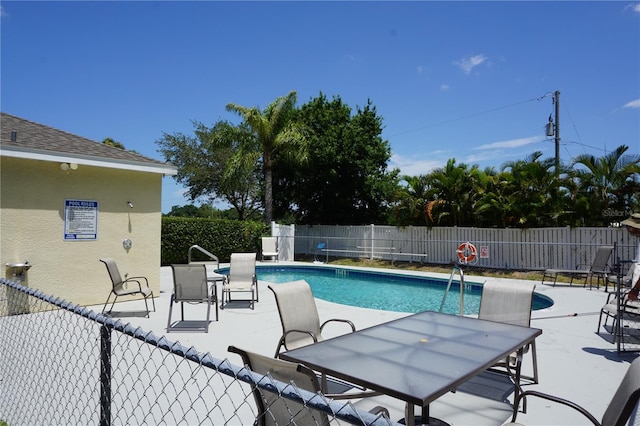 view of swimming pool with a patio