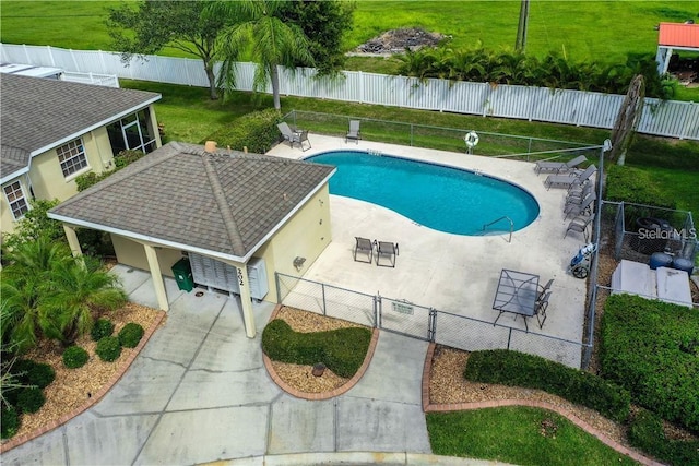 view of swimming pool with a patio