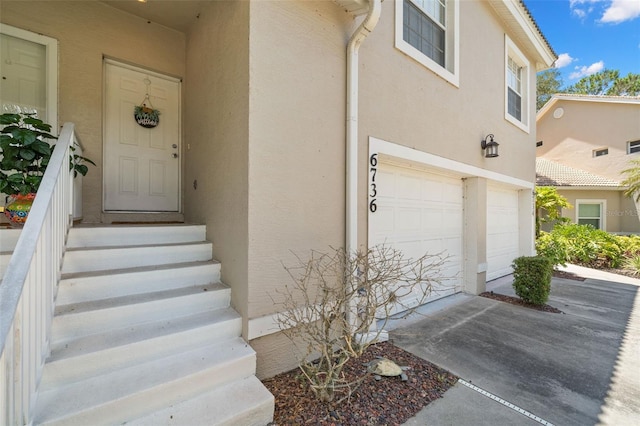 property entrance with a garage