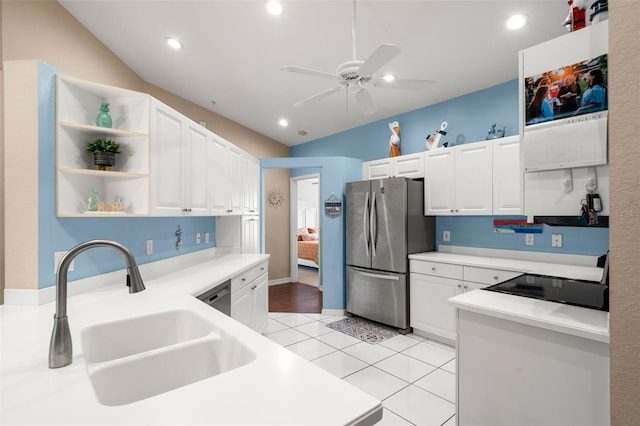 kitchen with sink, ceiling fan, stainless steel appliances, white cabinets, and light tile patterned flooring