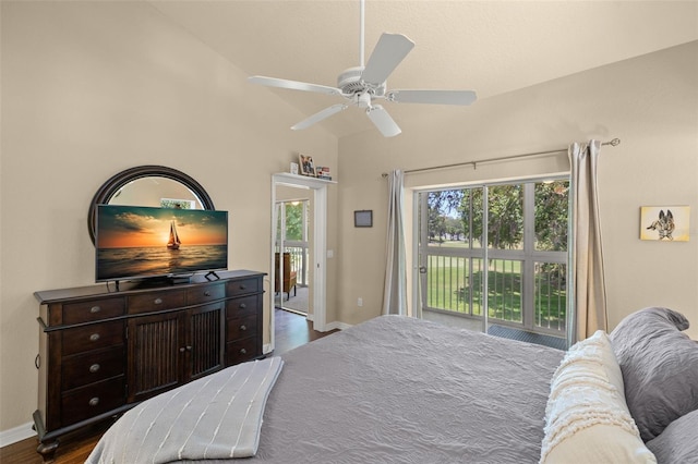 bedroom with lofted ceiling, dark hardwood / wood-style floors, access to outside, and ceiling fan