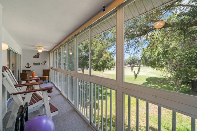 sunroom with a wealth of natural light and ceiling fan