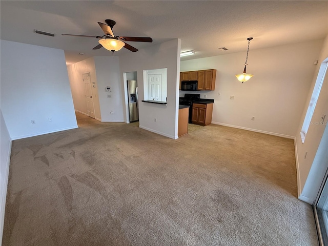 unfurnished living room with a ceiling fan, baseboards, and light colored carpet