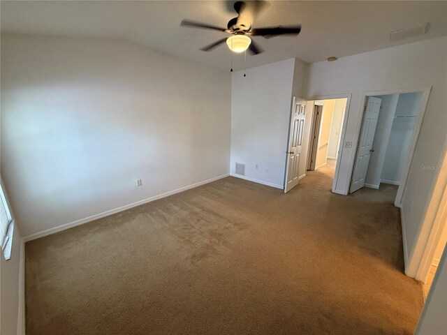 unfurnished bedroom featuring ceiling fan, carpet floors, baseboards, visible vents, and a closet