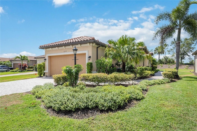 view of property exterior featuring a yard and a garage