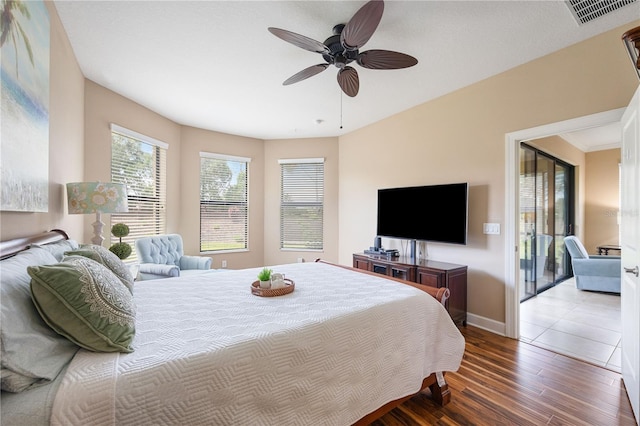 bedroom featuring ceiling fan and wood-type flooring