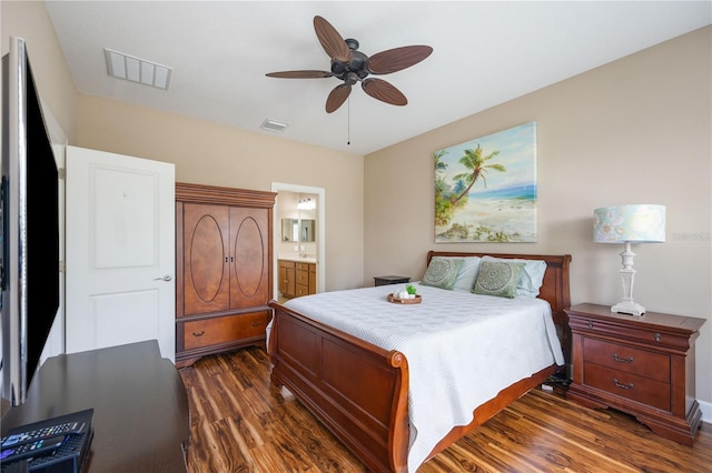 bedroom with connected bathroom, ceiling fan, and dark hardwood / wood-style floors