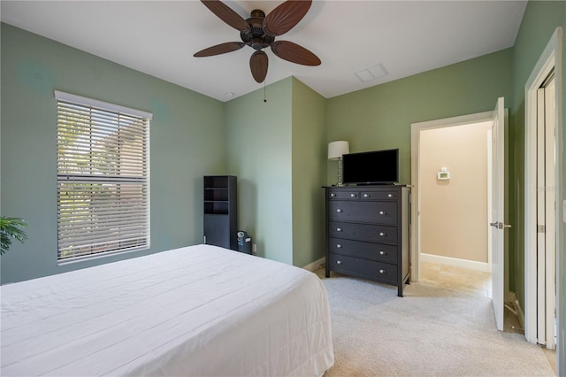 carpeted bedroom featuring ceiling fan