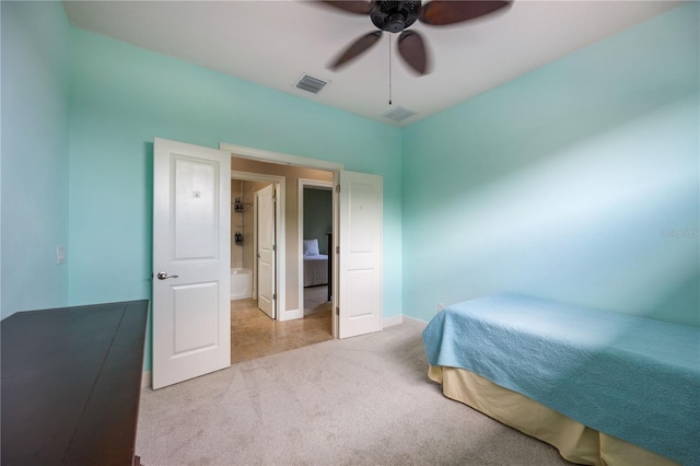 bedroom featuring ceiling fan and light colored carpet