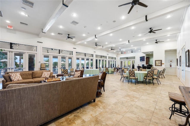 living room with beamed ceiling and french doors