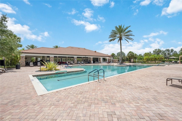 view of swimming pool with a patio