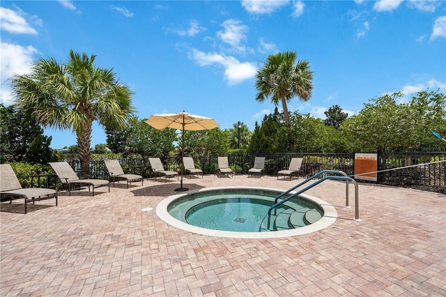 view of swimming pool featuring a community hot tub