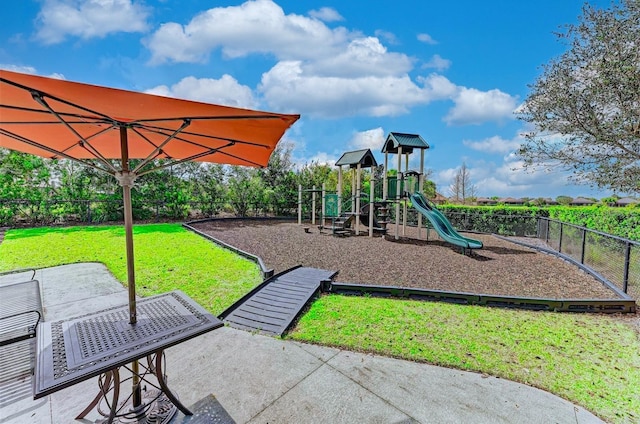 view of playground with a yard