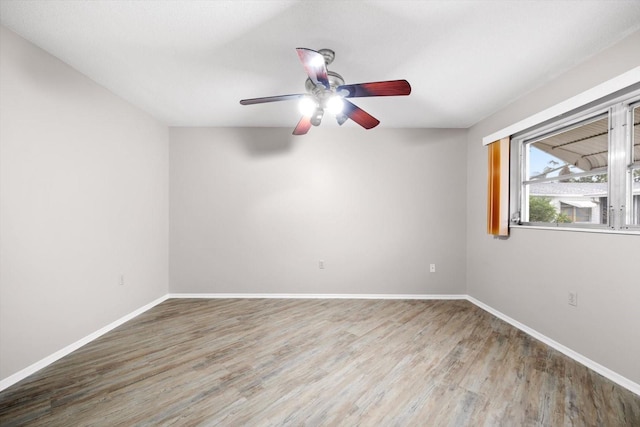 spare room featuring ceiling fan and wood-type flooring