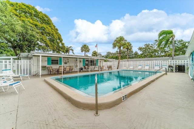 view of swimming pool featuring a patio