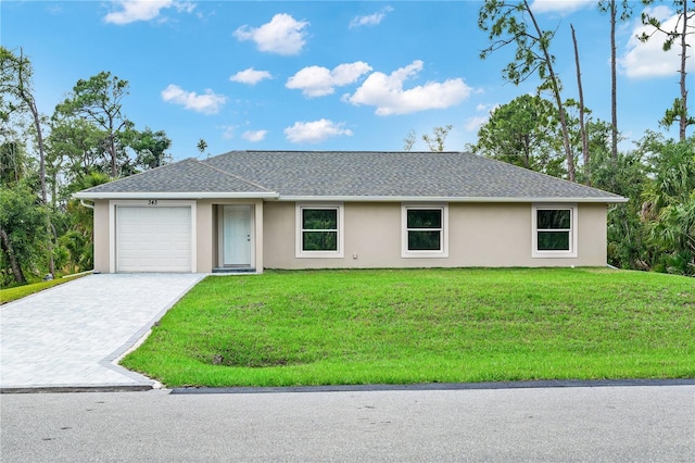 single story home with a garage and a front yard