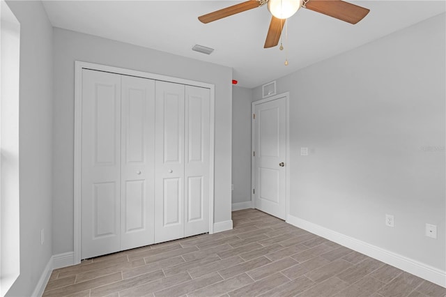 unfurnished bedroom with a closet, ceiling fan, and light hardwood / wood-style flooring