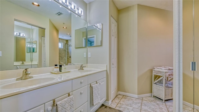 bathroom featuring tile flooring, double sink, and oversized vanity