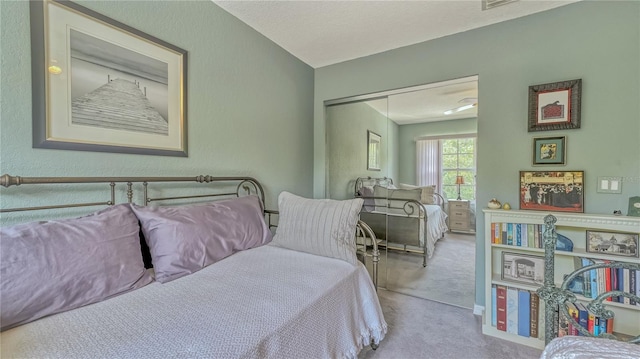 bedroom with a closet and carpet floors