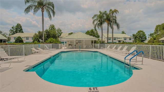 view of swimming pool featuring a patio area