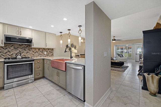 kitchen with ceiling fan, stainless steel appliances, decorative light fixtures, light tile flooring, and backsplash