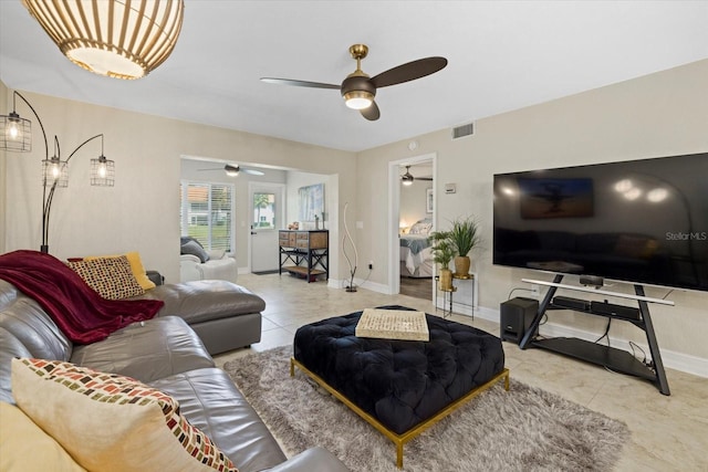 tiled living room with ceiling fan