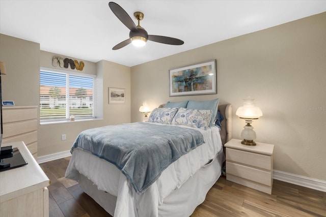 bedroom with ceiling fan and hardwood / wood-style floors