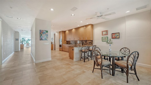 dining room featuring ceiling fan