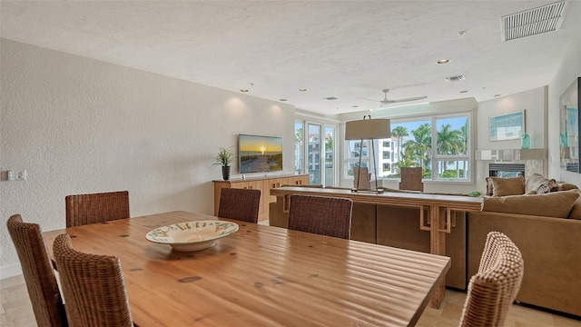 dining space with ceiling fan