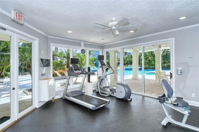 workout area featuring french doors, ceiling fan, a textured ceiling, and a wealth of natural light