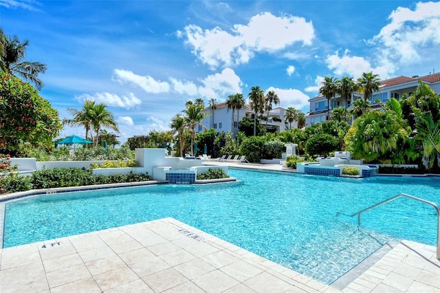 view of pool featuring pool water feature