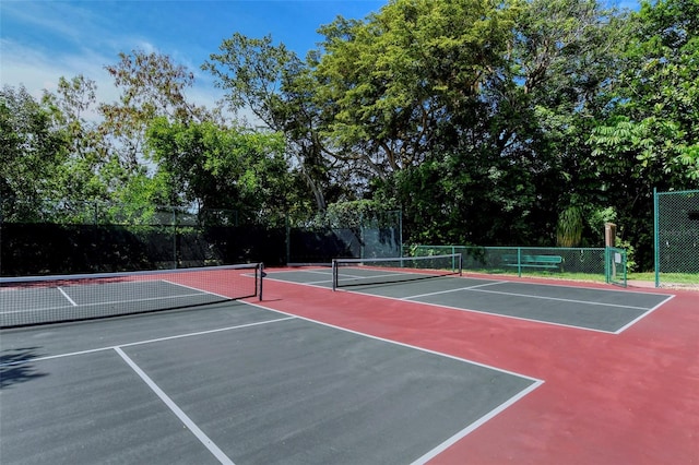 view of sport court featuring basketball hoop