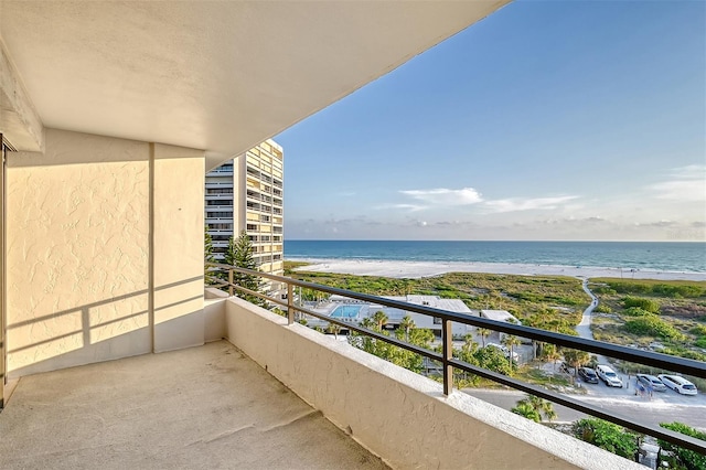 balcony with a view of the beach and a water view