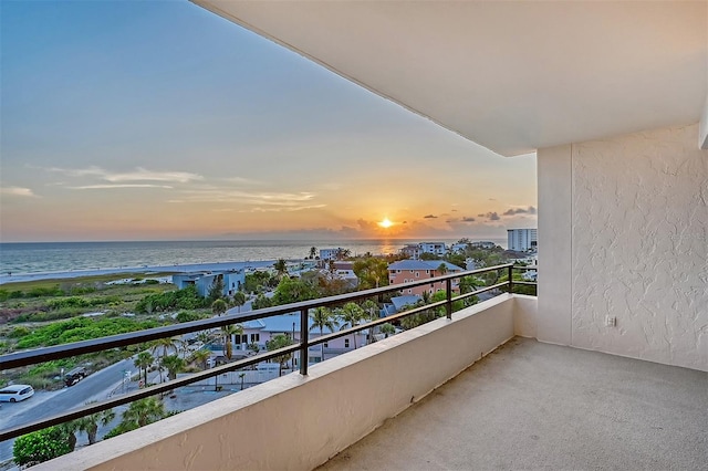 balcony at dusk with a water view