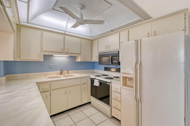 kitchen featuring light tile patterned floors, ceiling fan, white appliances, cream cabinets, and sink