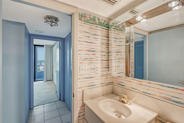 bathroom with tile patterned flooring and sink