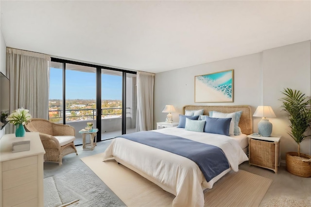 bedroom featuring access to exterior and expansive windows