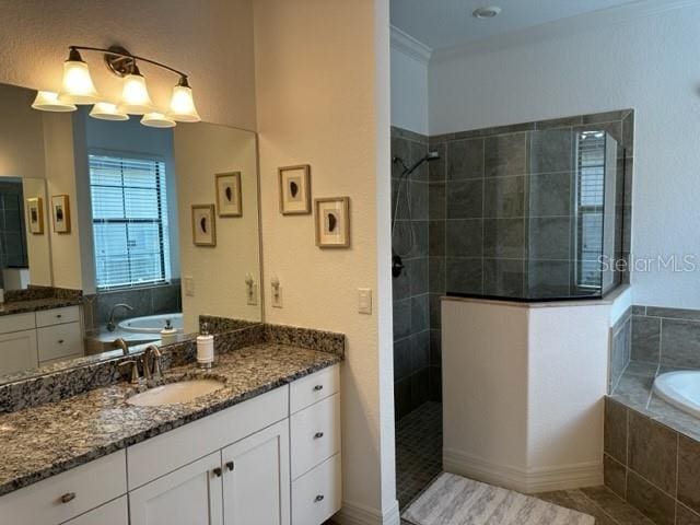 bathroom with tile patterned floors, vanity, ornamental molding, and independent shower and bath