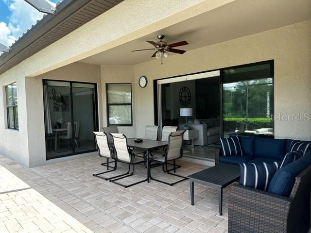 view of patio / terrace featuring an outdoor living space and ceiling fan