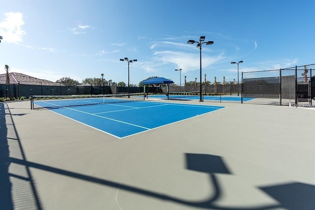 view of sport court featuring basketball hoop