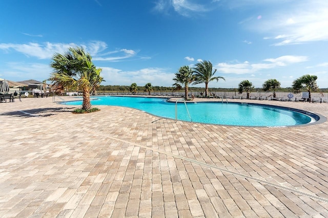 view of swimming pool featuring a patio