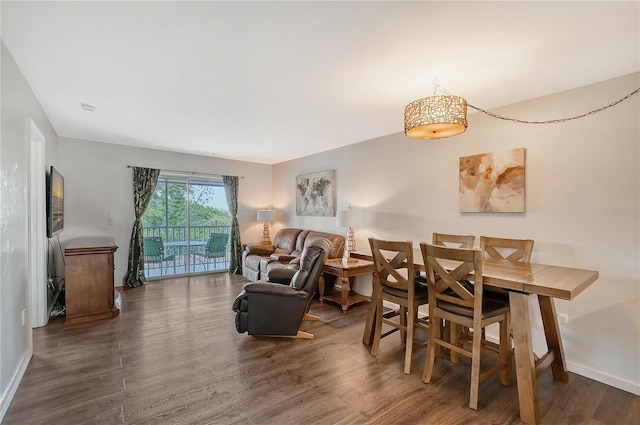 dining area with dark wood-type flooring