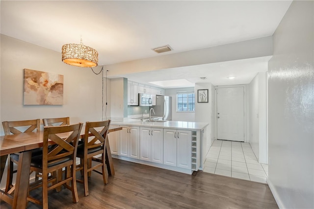 dining space with light hardwood / wood-style floors