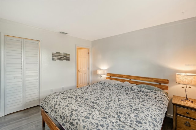 bedroom featuring a closet and wood-type flooring