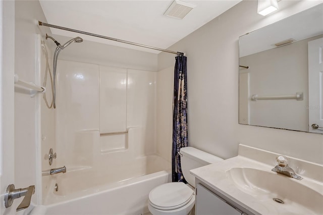 full bathroom with shower / tub combo with curtain, vanity, and toilet