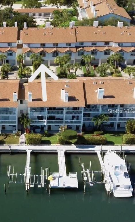 bird's eye view featuring a water view and a residential view