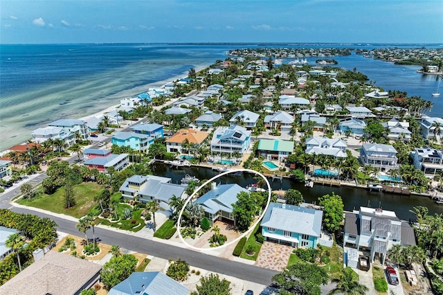 birds eye view of property featuring a residential view and a water view