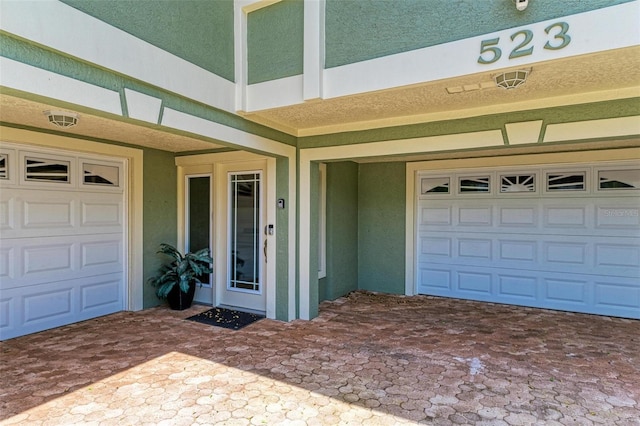 property entrance with a garage